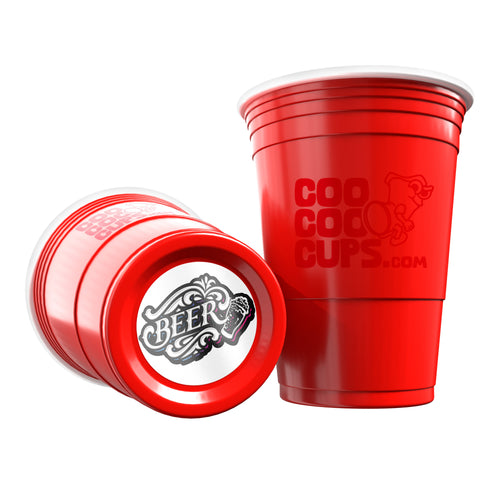 Two red CooCoo Cups® are shown. One displays the logo while the other lies on its side, revealing a bottom sticker featuring a cool “BEER” text and graphic.