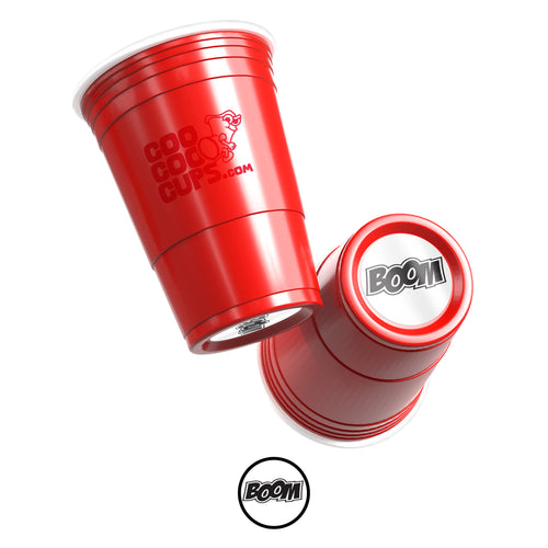 Two red CooCoo Cups® are shown. One displays the logo while the other reveals a bottom sticker featuring “BOOM” text.